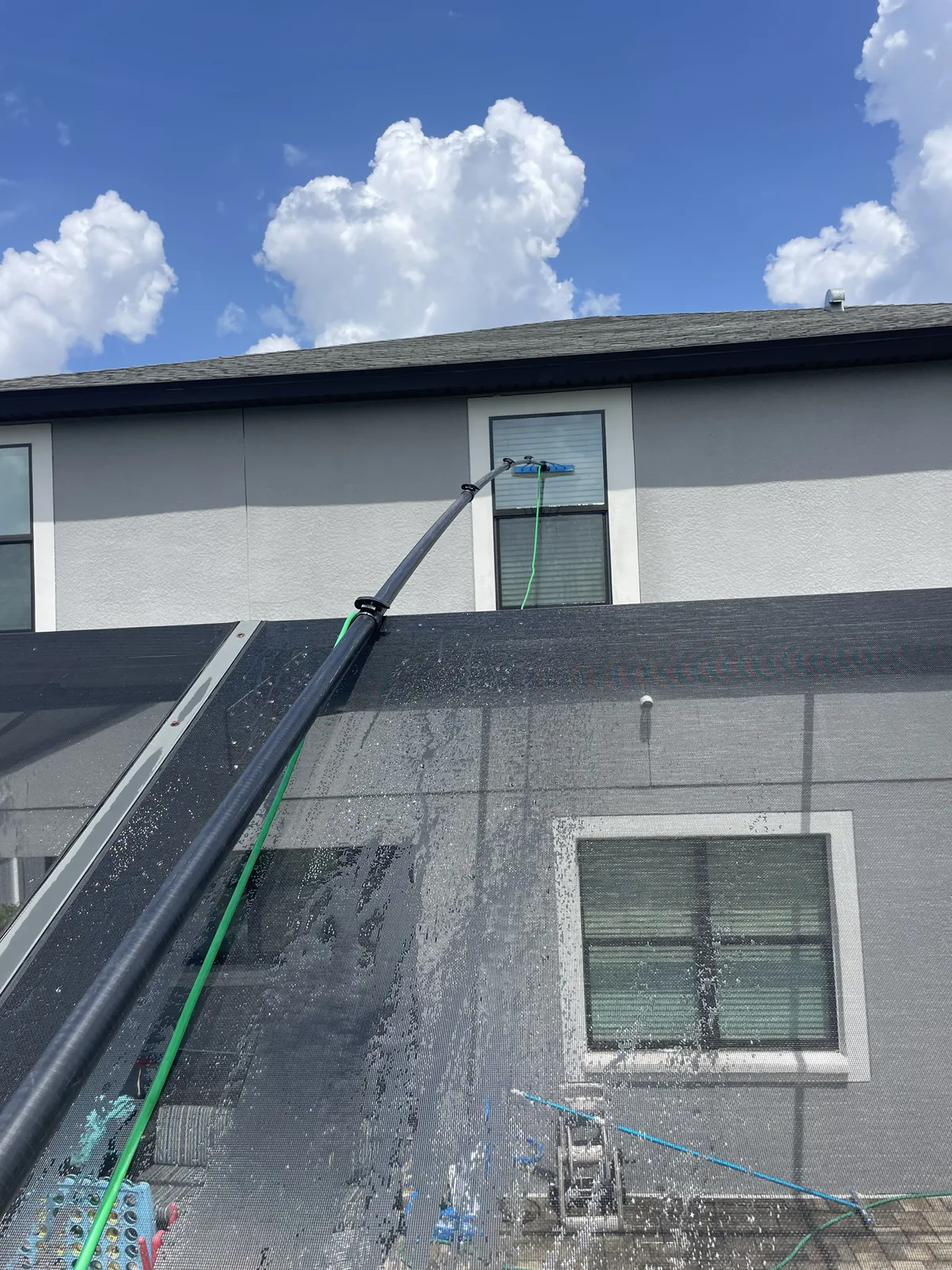 Safe long-reach window cleaning in action by Tampa Bay Shine